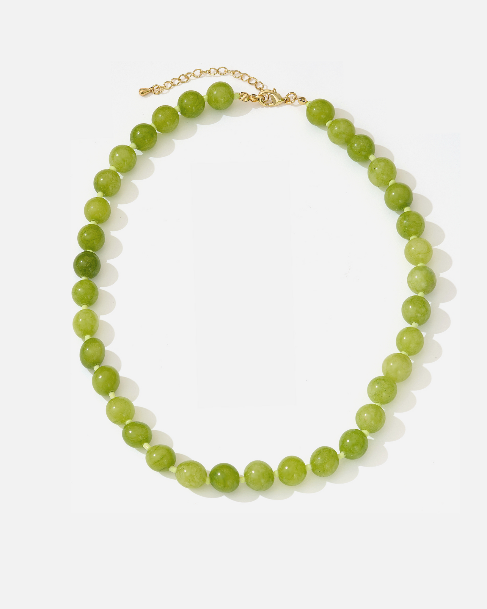 Sun Muse Emma green agate necklace – natural gemstone beaded necklace with gold clasp, laid flat.”